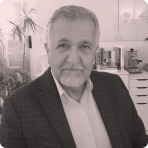 Touraj Rahimi, founder of Olibro Design, in a professional setting, showcasing expertise in digital strategy and technology.