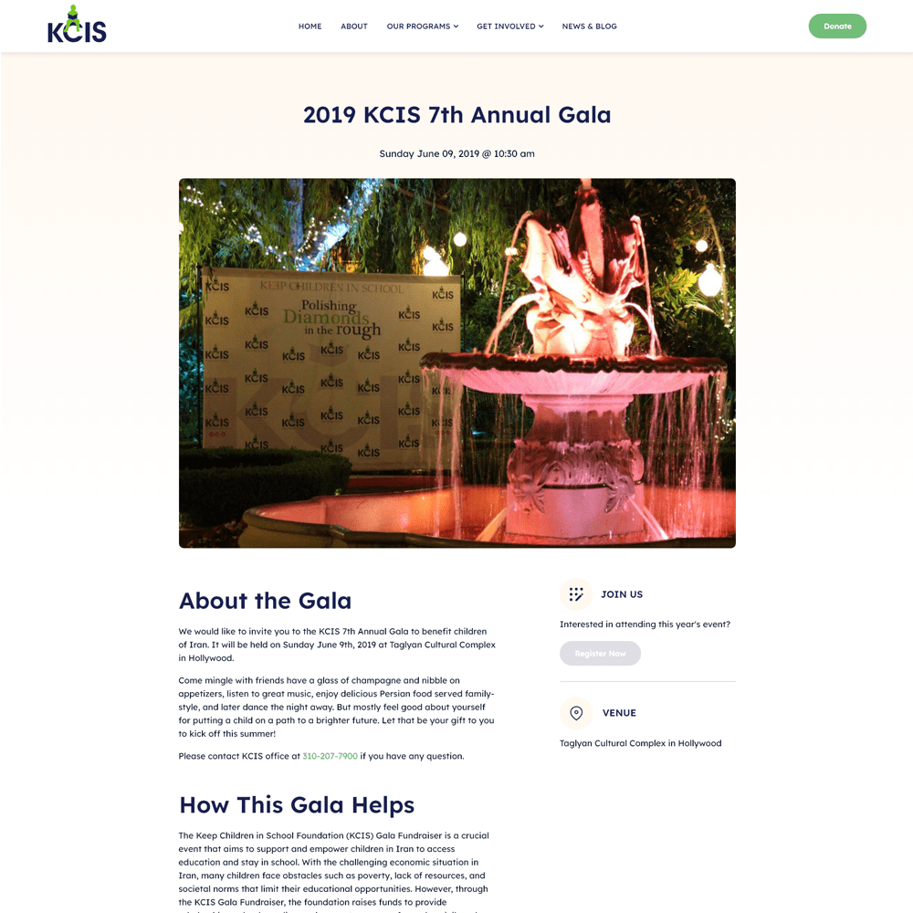 Fountain at KCIS 7th Annual Gala, surrounded by greenery, with a backdrop displaying the KCIS logo and the phrase "Polishing Diamonds in the Rough."