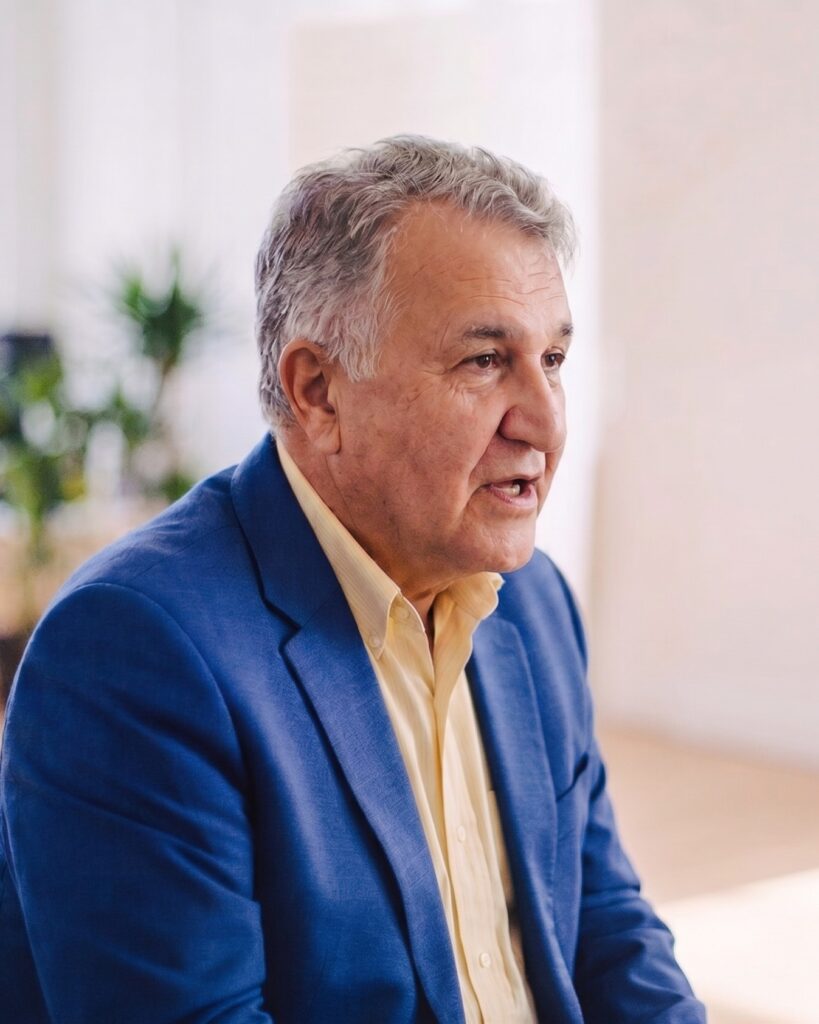 Touraj Rahimi, Olibro founder, talking with a colleague at the Olibro office